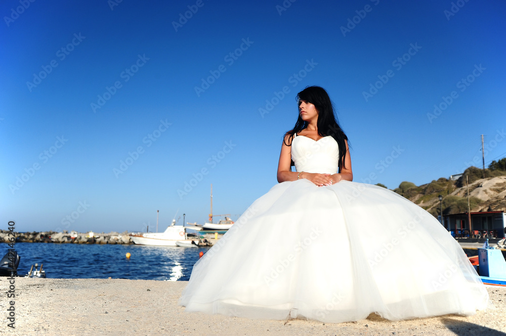 Bride on a Santorini port in Greece Bride on a Santorini port in Greece