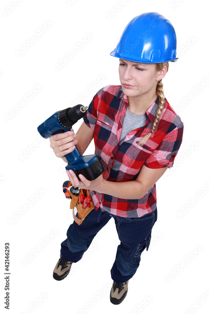 Woman with a cordless power drill Woman with a cordless power drill