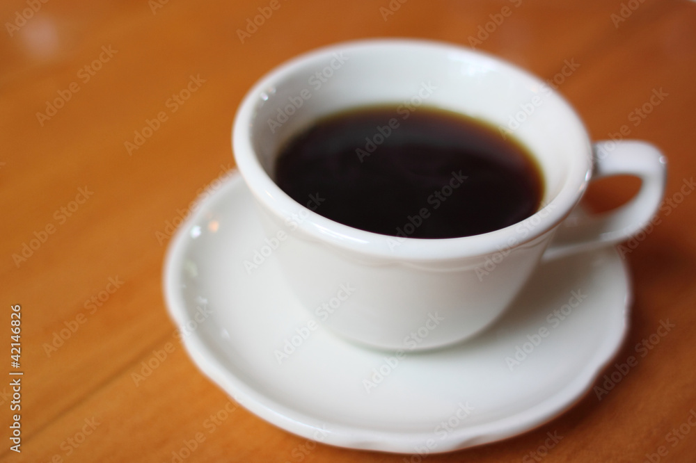 Coffee cup on a table.