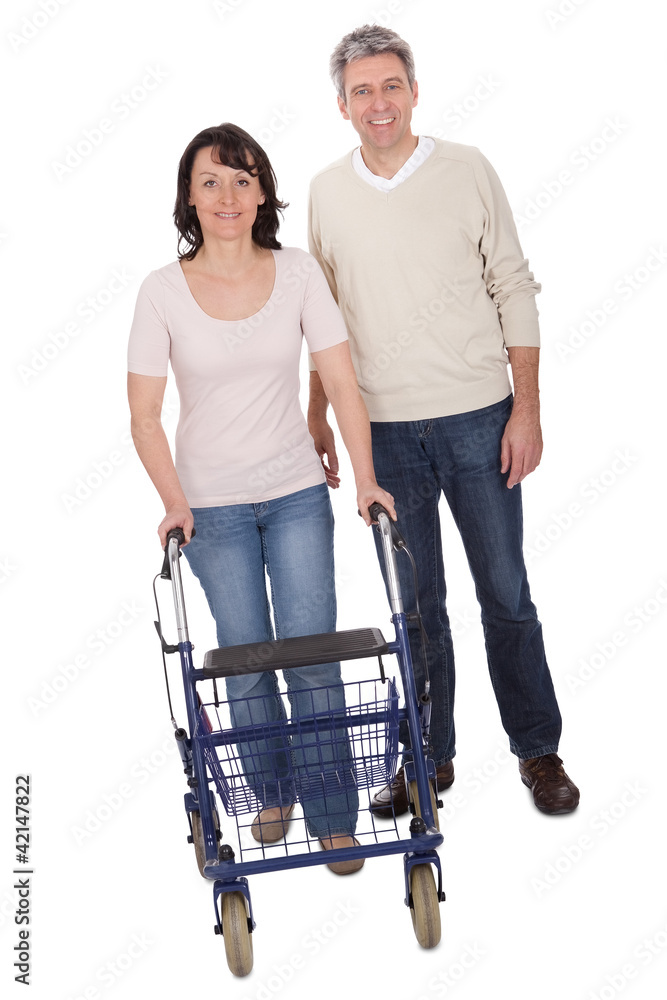 Mature couple using walking aide Mature couple using walking aide