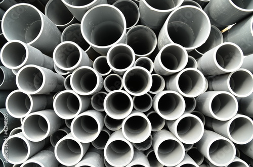 Gray plastic pipes stacked
