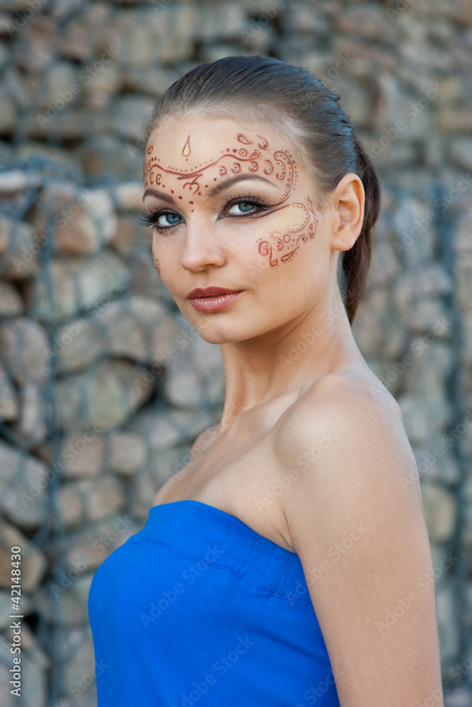 A young woman with a body-art on the face A young woman with a body-art on the face
