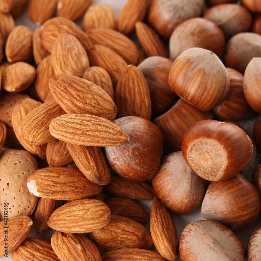 close up on heap of almond and hazelnut close up on heap of almond and hazelnut