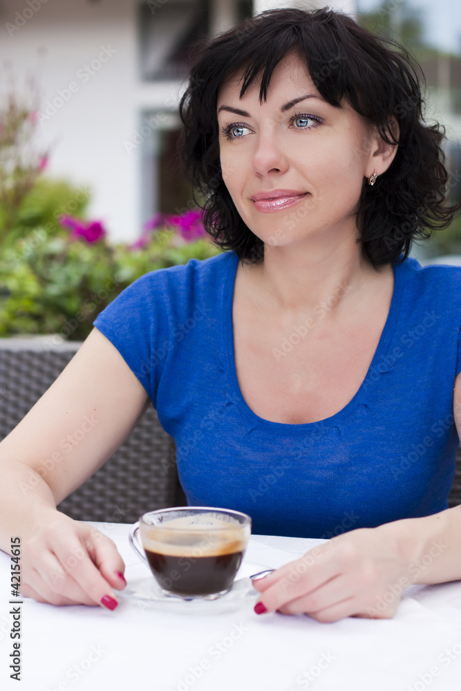 Beautiful woman in street cafe ,with cup Beautiful woman in street cafe ,with cup