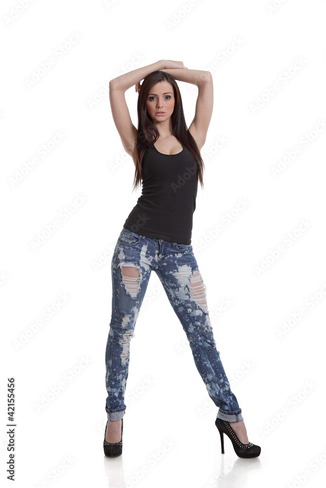 Full length posing girl in jeans and high heels Full length posing girl in jeans and high heels