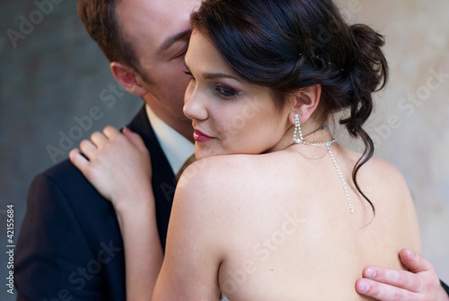 bride and groom hugging in empty room