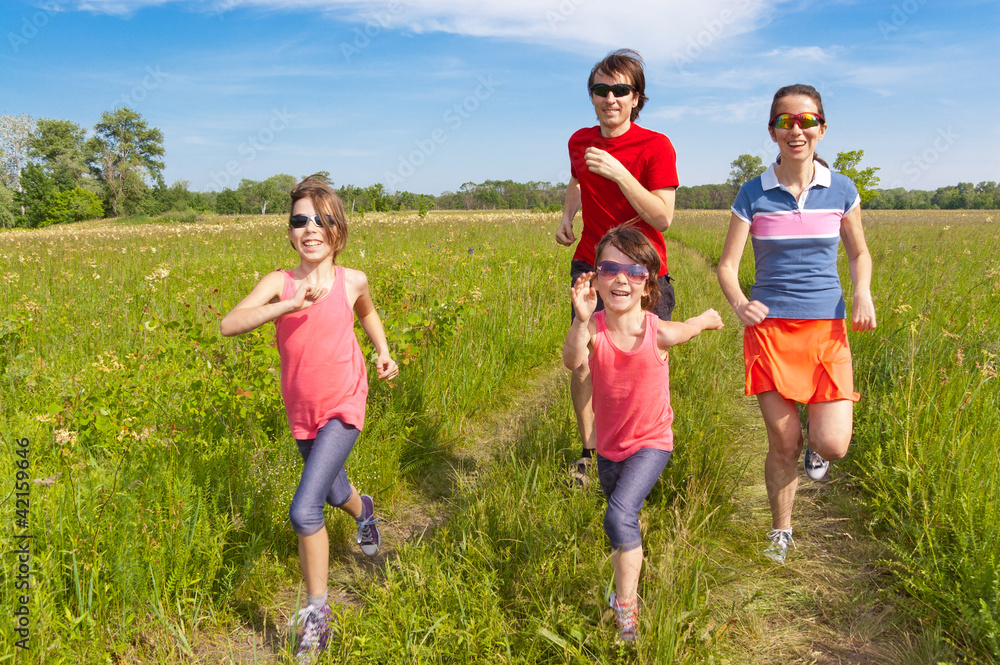 Family sport, jogging outdoors. Happy parents with kids run Family sport, jogging outdoors. Happy parents with kids run