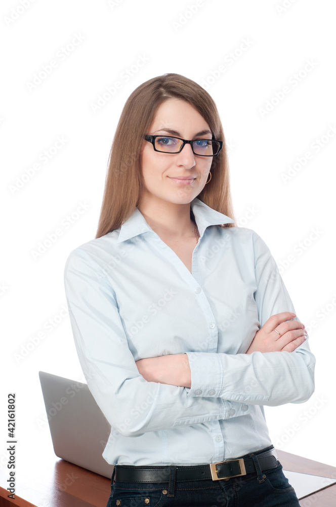 Beautiful girl standing with his arms folded. He smiles. On a wh Beautiful girl standing with his arms folded. He smiles. On a wh