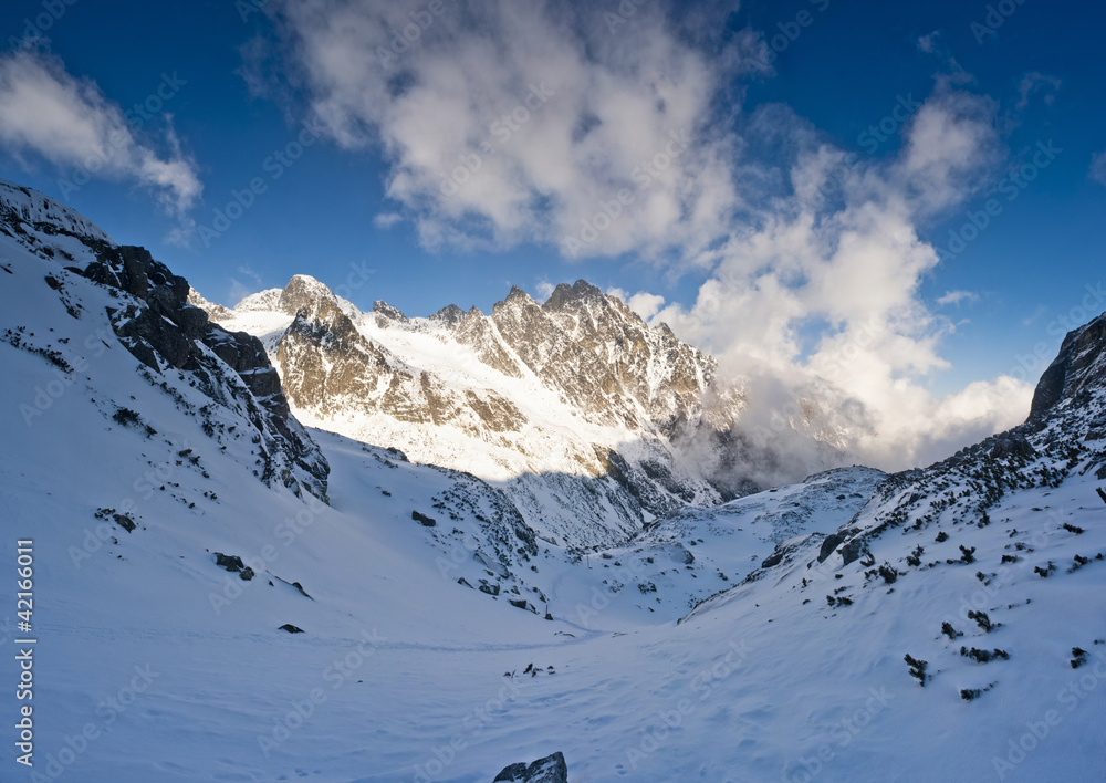 Fototapeta premium Panorama of winter mountains in evening