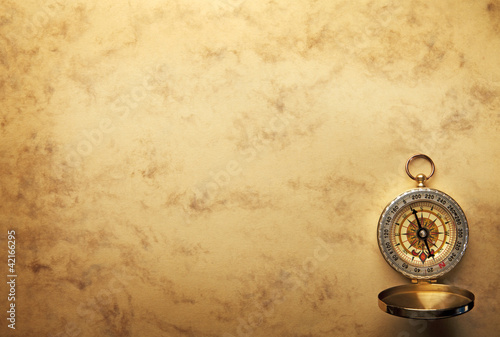 Compass on the old paper background