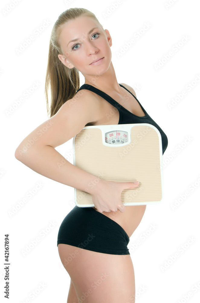 The sports girl with scales isolated on white background The sports girl with scales isolated on white background