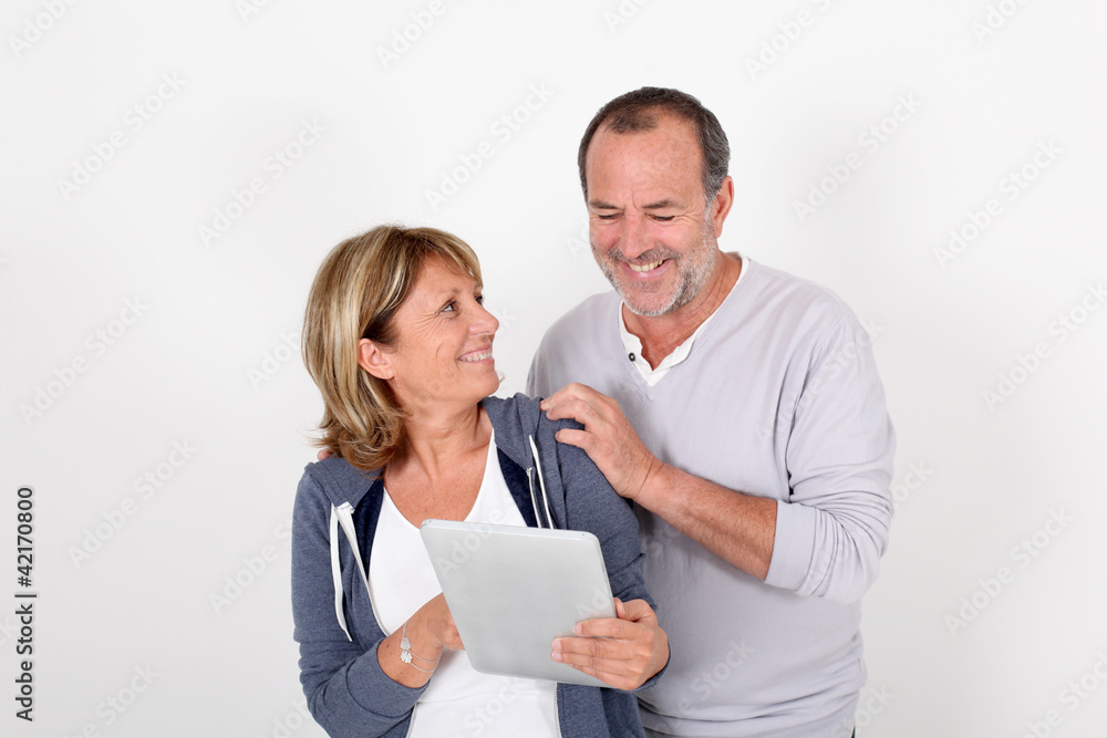 Senior couple having fun with electronic tablet Senior couple having fun with electronic tablet