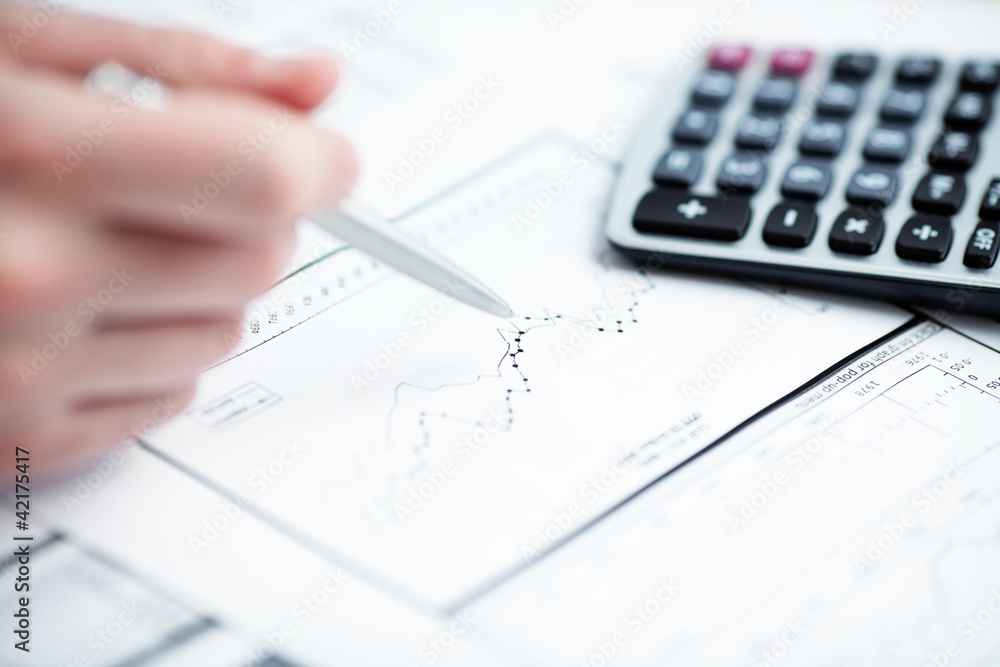 Financial data analyzing. Counting on calculator. Financial data analyzing. Counting on calculator.
