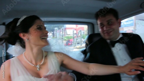 bride and groom have a fun in the car 2