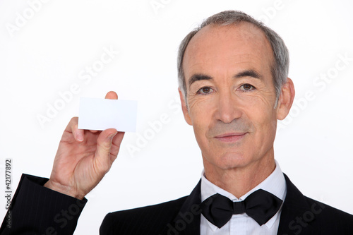 Fotografie Waiter holding business card