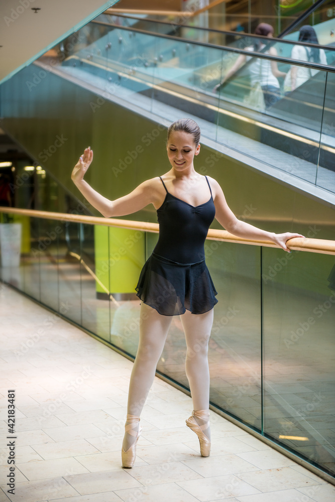 Ballet dancer at escalator