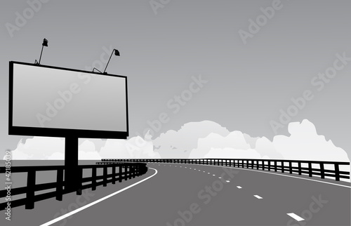 grey billboard near modern road