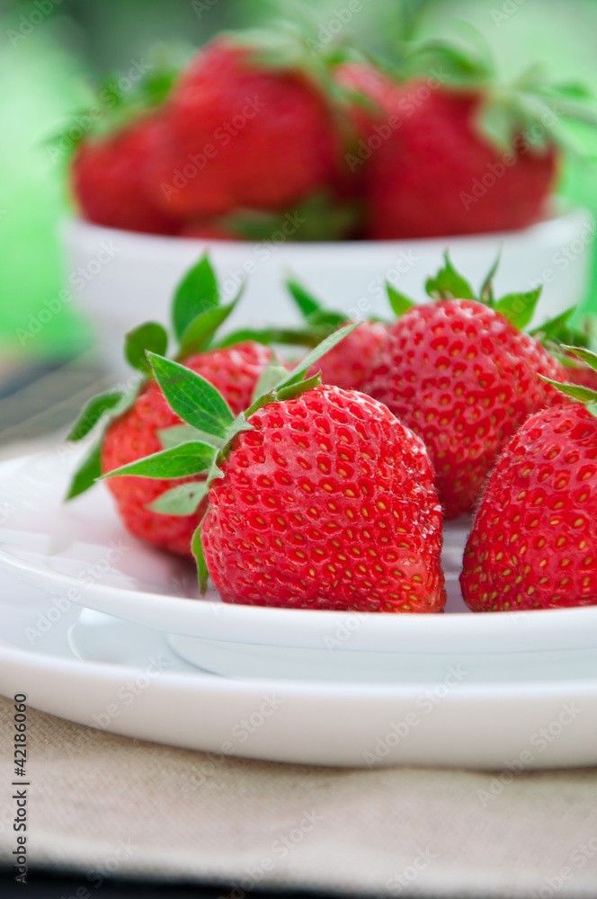 Fresh strawberries in white bowl Fresh strawberries in white bowl