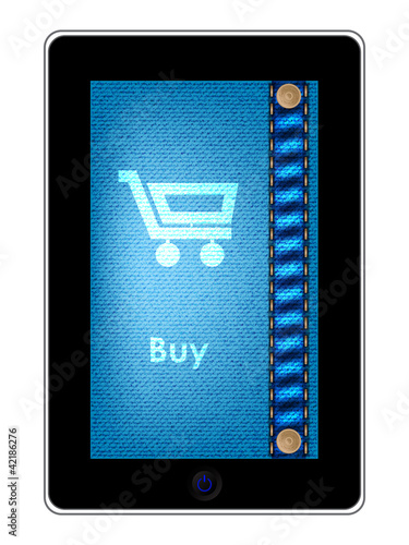 tablet pc with a shopping cart on jeans backgound