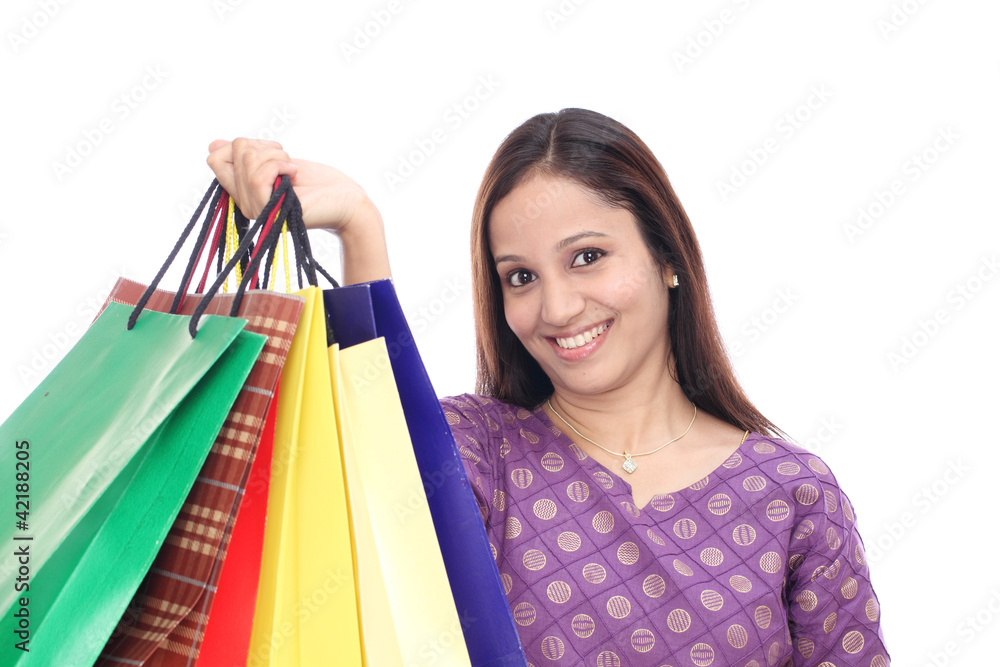 woman holding shopping bags and smiling woman holding shopping bags and smiling