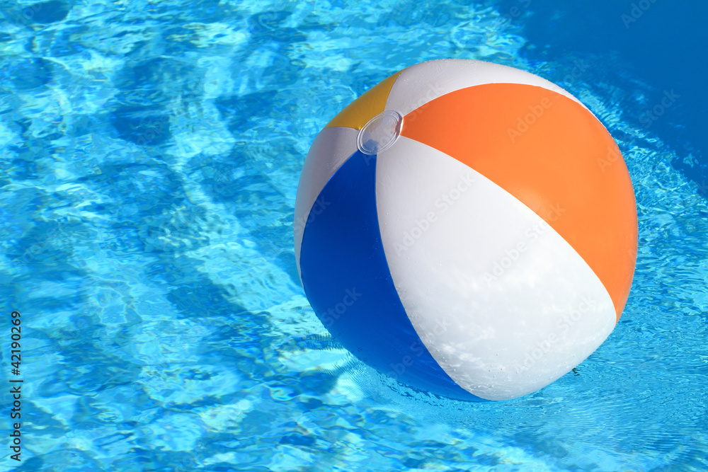 Summer background. Beach Ball on the swimming Pool