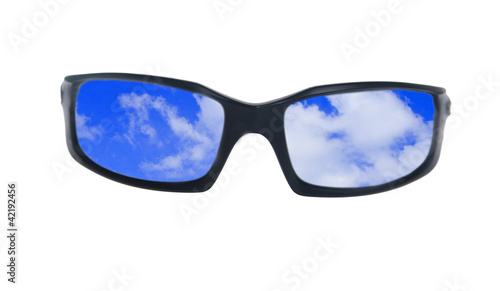 Blue skies reflecting in sunglasses isolated on white