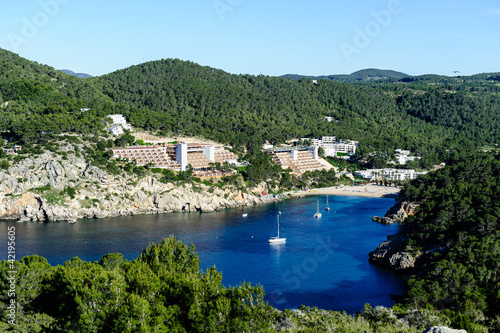 Evissa island bay view with sailboat anchorage. photo