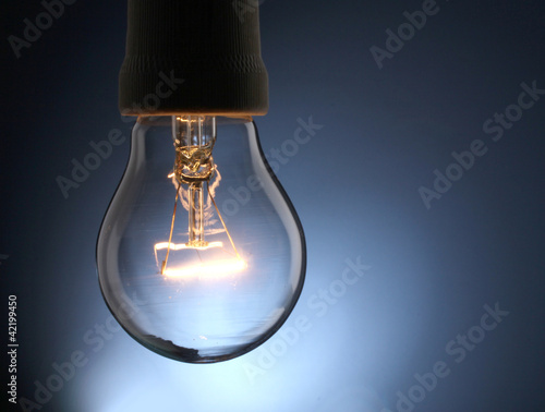 A lit light bulb isolated on white