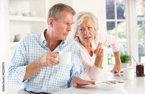 Retired couple arguing at breakfast