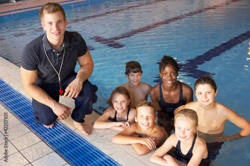 Children having swimming lesson