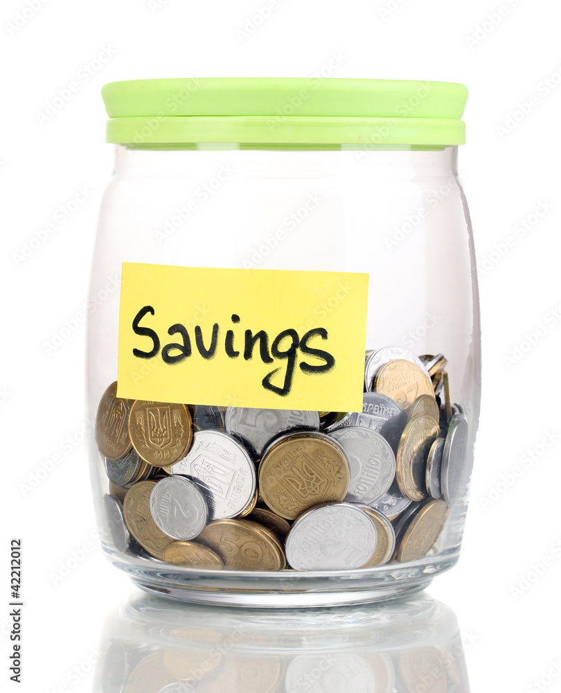 Glass bank for tips with money isolated on white Glass bank for tips with money isolated on white