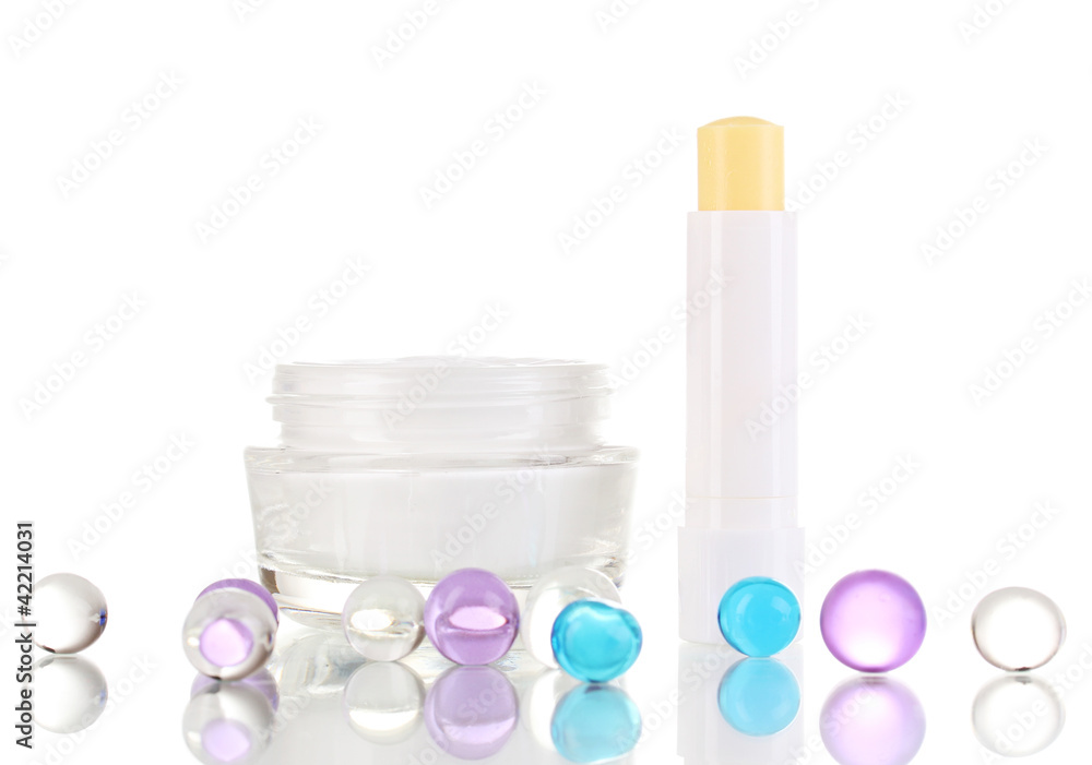 Hygienic lipsticks and moisturizing cream isolated on white Hygienic lipsticks and moisturizing cream isolated on white