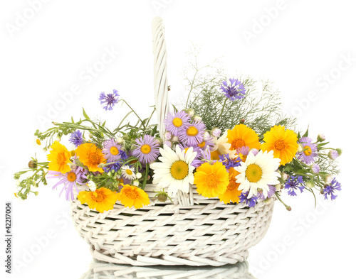 bouquet of wildflowers in basket isolated on white