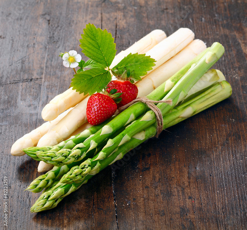 Decorative bunches of green and white asparagus photo