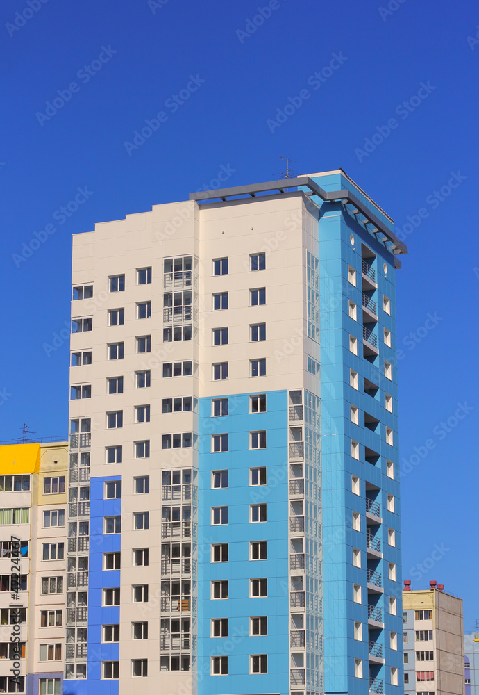 The inhabited high house against the blue sky