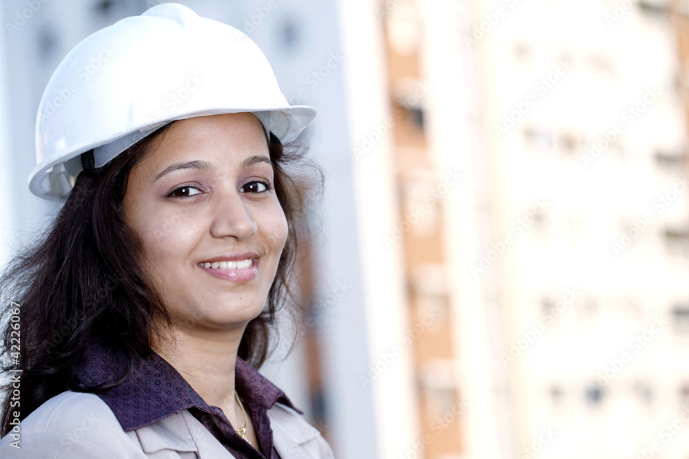 Smiling young female construction engineer Smiling young female construction engineer