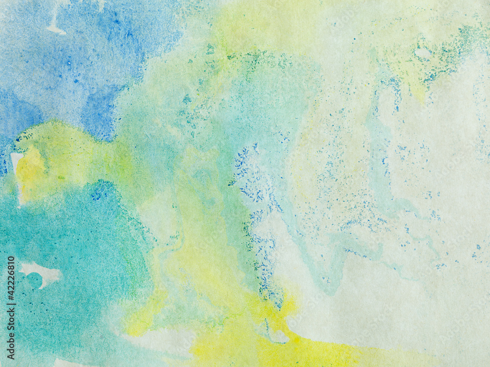 paper with blue green and yellow paint abstract