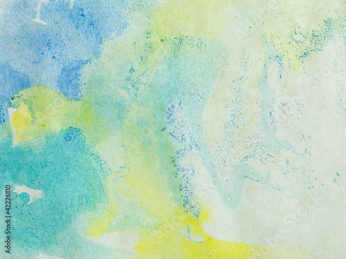 paper with blue green and yellow paint abstract