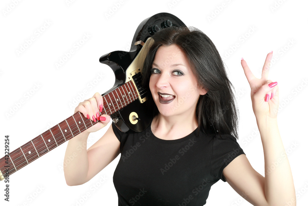 Fototapeta premium Brunette girl posing with a guitar isolated