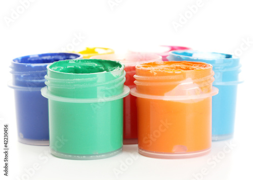 jars with multicolored gouache isolated on white background