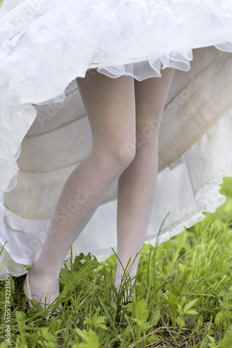 Vászonkép Female feet under a crinoline