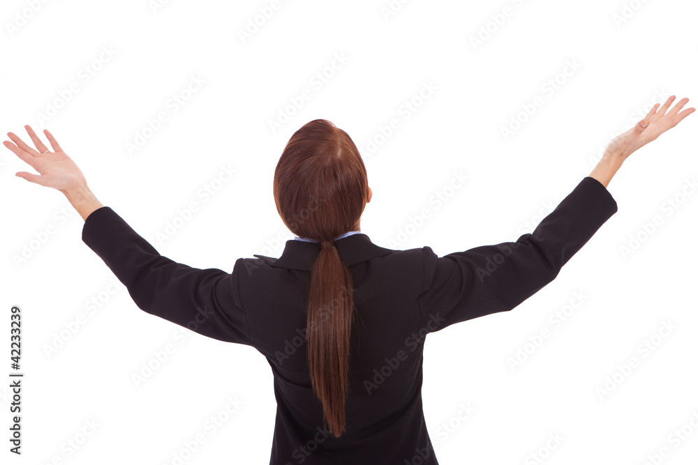 back of a business woman holding her hands up