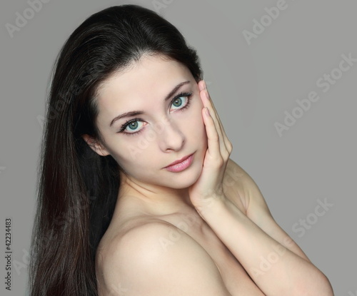 Beautiful clean skin face young woman looking. isolated portrait