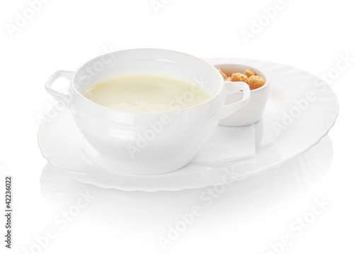 A bowl of creamy vegetable soup isolated