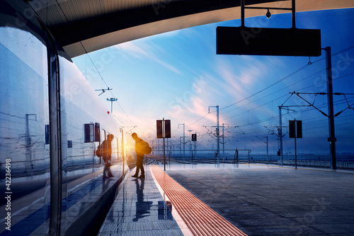 Obraz na plátně train stop at railway station with sunset