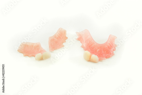 broken denture and perfect denture