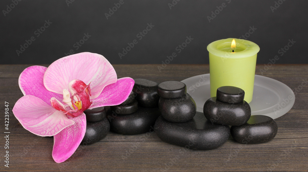 Spa stones with orchid flower and candle