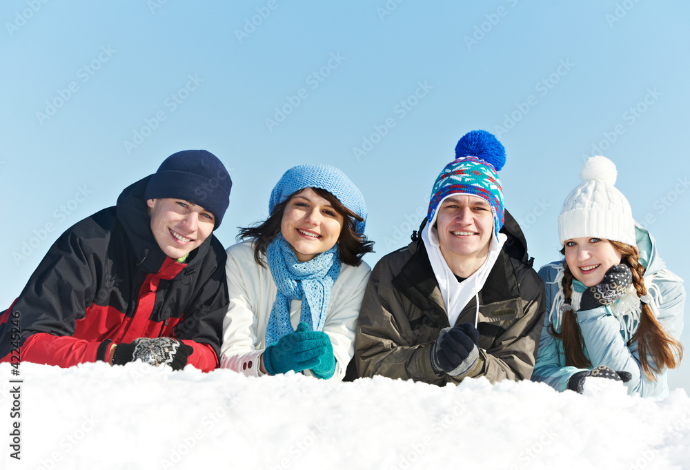 group of happy young people in winter