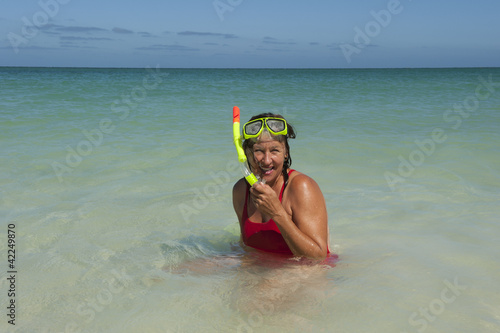 Woman snorkelling swimming tropical ocean