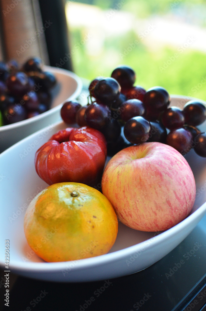 Variety of Fresh Fruits in whie bowl Variety of Fresh Fruits in whie bowl